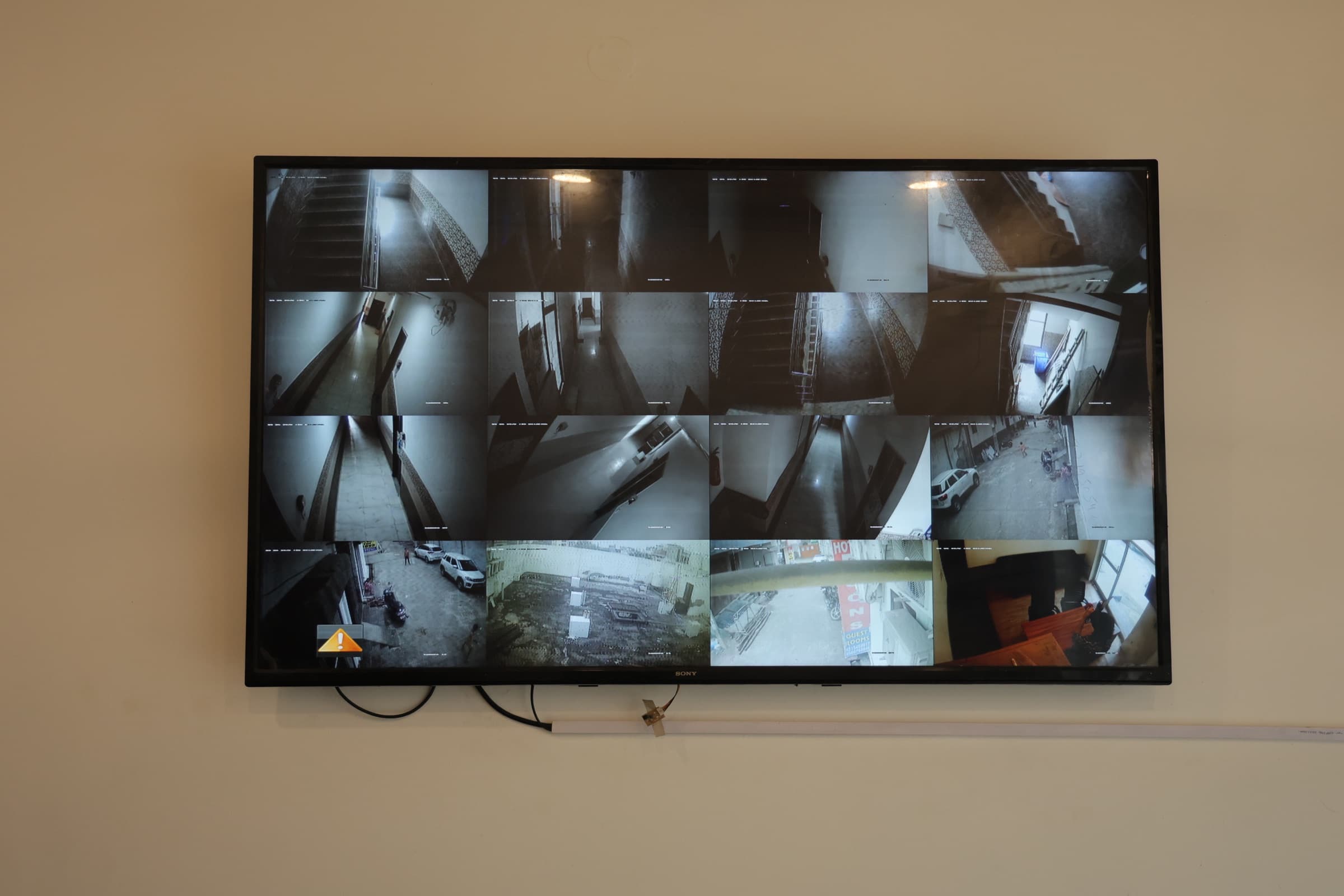 CCTV monitoring screen showing Vedanta PG common areas