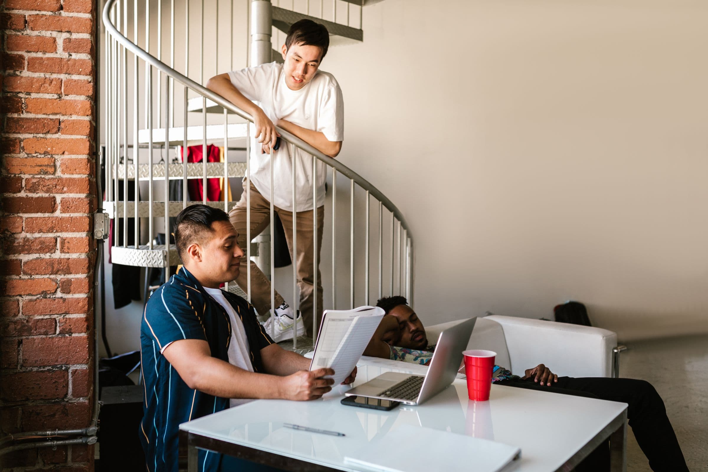 College roommates studying together in a shared apartment